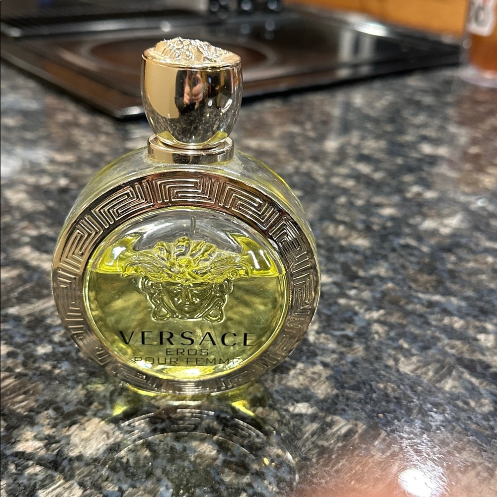 Versace Eros Pour Femme Perfume 3.4 Fl oz a little over half full. Has lid